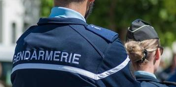 Brisach - France - 1 May 2018 - french gendarmerie patrol in lily of the valley party in the street